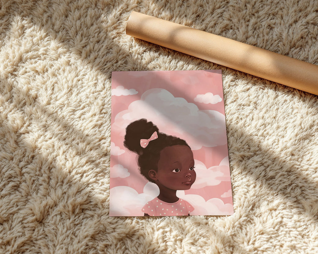 A-Sized Prints Nursery - Peaceful portrait of a child with brown skin and pink spotted dress against cloud backdrop